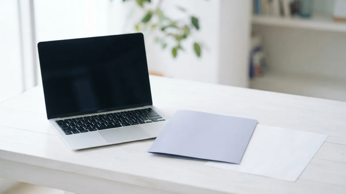 Laptop beside a plain folder during removal of unwanted browser software