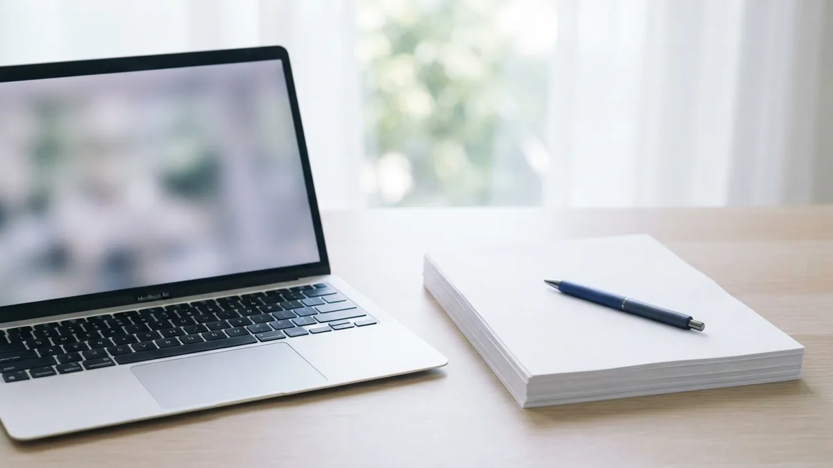 Review and edit a converted document Laptop and blank pages ready for careful edits to a converted document