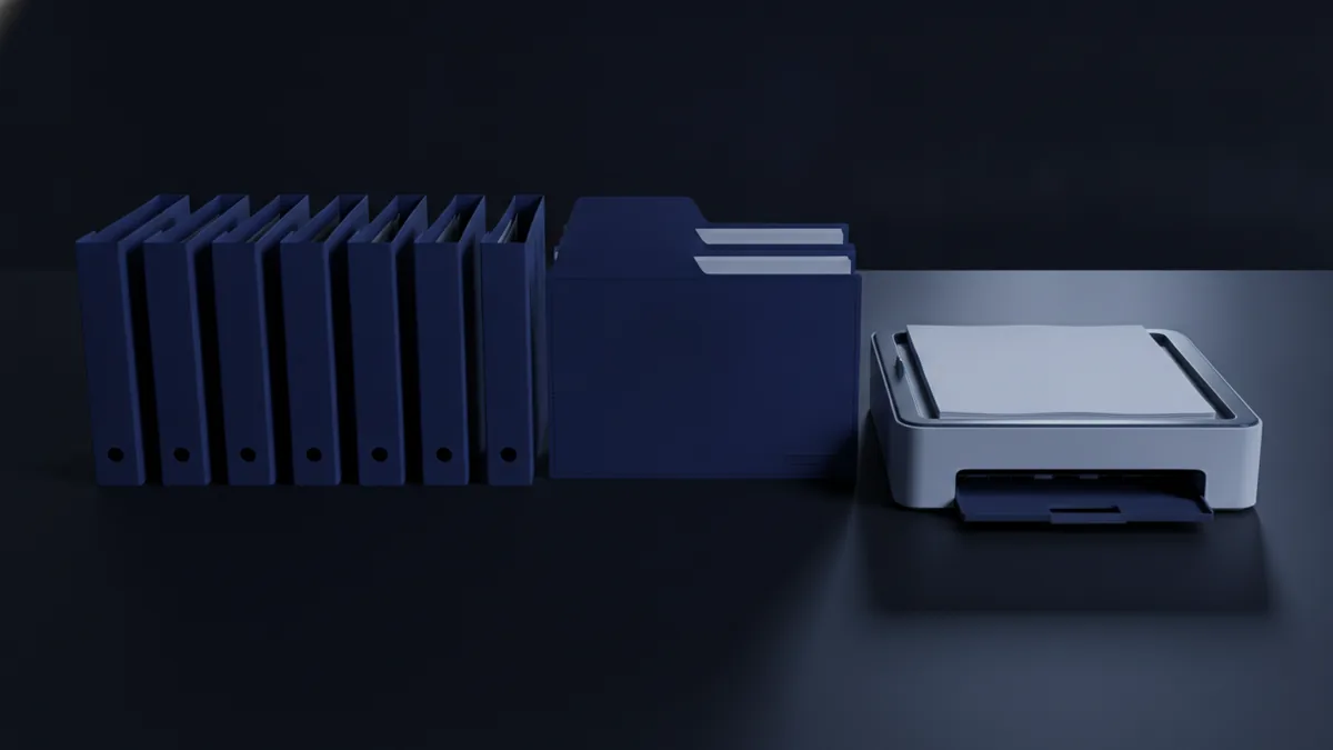 Several PDF folders arranged in order beside a printer paper tray