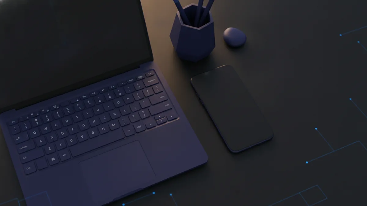 Overhead desk scene with laptop and phone, suggesting quick online PDF compression steps.