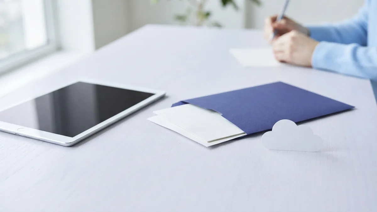 Tablet and blank documents arranged for saving PDF files on iPad