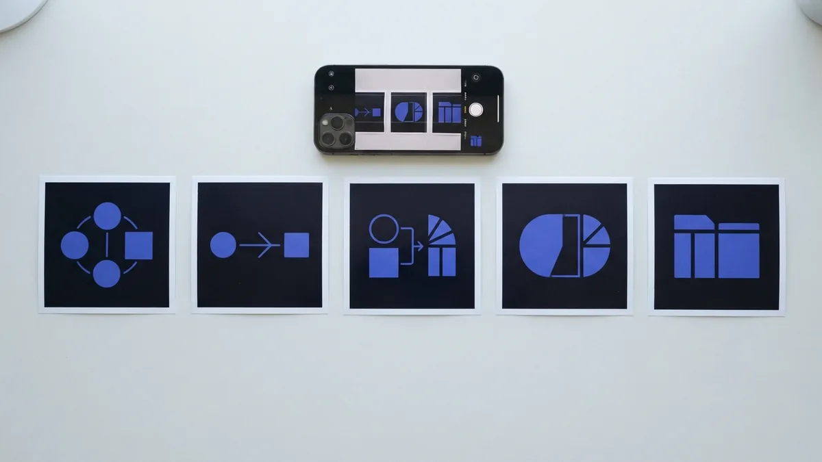 Set up photos for a Notes scan Printed photos arranged for scanning with an iPhone on a flat surface