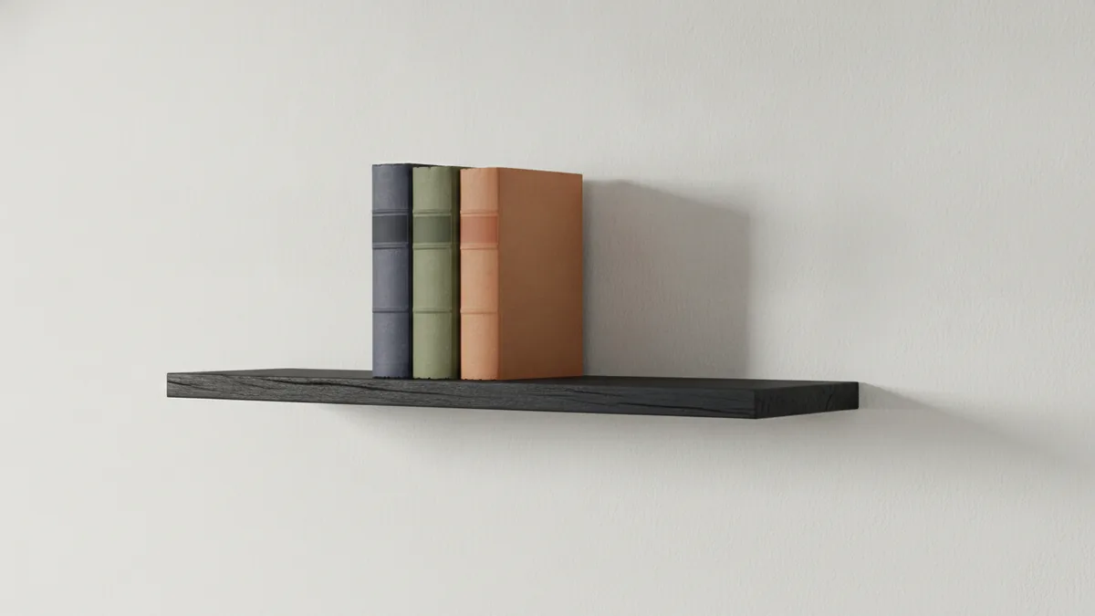 Setting up to start reading Minimal bookshelf with a few well-worn books in soft light